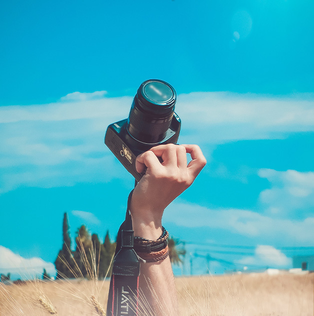 Services-4-Hand-holding-camera-flip-628×632